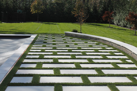 Grass and Marble Patio by Curti's Landscaping