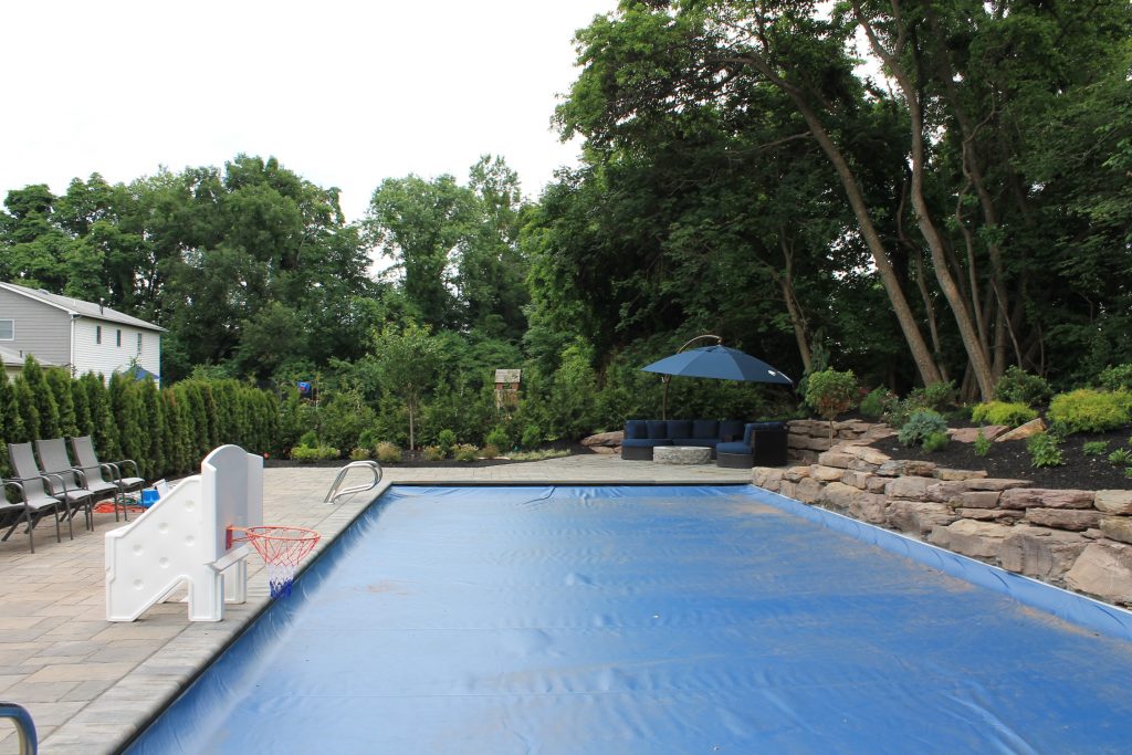 pool coping, patio, stone wall