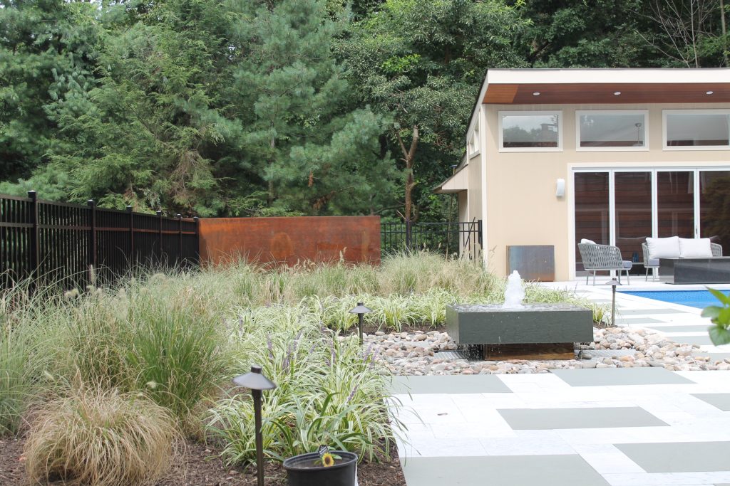 Landscaping with patio and water feature