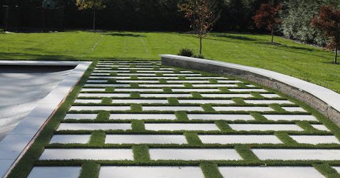 Grass and Marble Patio by Curti's Landscaping